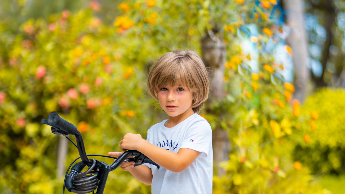 Boy standing next to a blue kids' bike