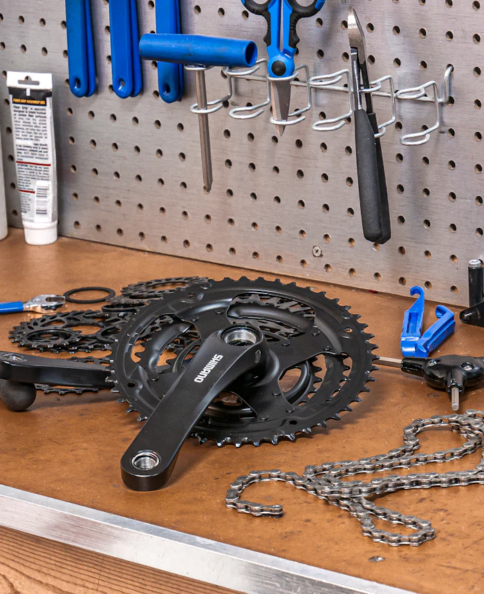 Bicycle spare parts and tools on a workbench