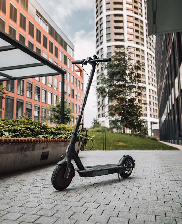 Kick scooter parked on a city pavement